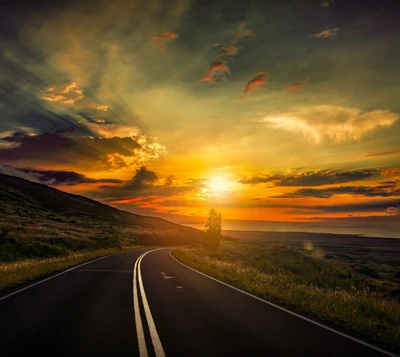 Meandering Road Under a Vibrant Sunset