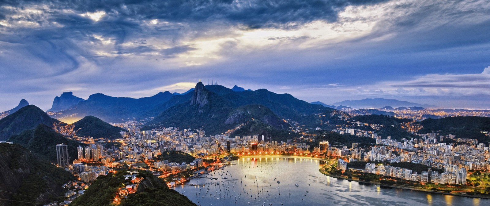 A view of rio from the top of sugar mountain (copacabana beach, beach, mountain, mountain range, landmark)