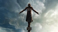 Assassin's Creed Origins : Statue de l'Assassin contre un ciel dramatique