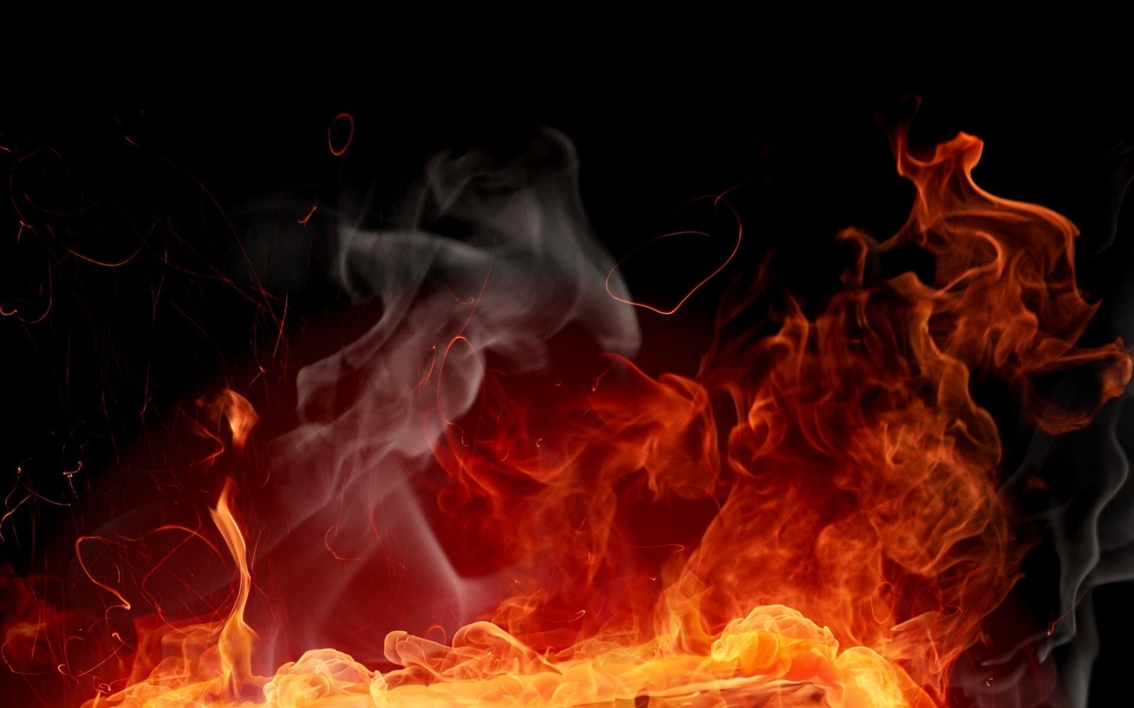 Flames and smoke are rising from a black background (fire, heat, special effects, smoke)