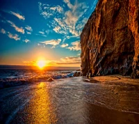 Golden Sunset Over Rugged Coastal Cliffs