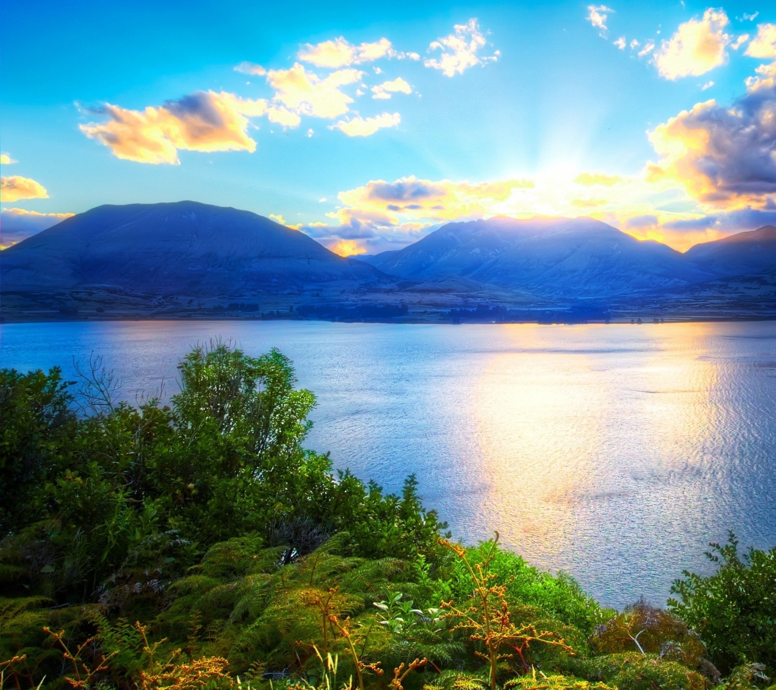 A view of a lake with a mountain in the background (lakes, landscape, nature)