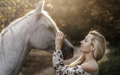 Serene Connection: Girl and White Horse in Golden Light