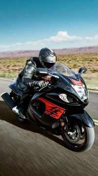 Girl Riding a Heavy Black Motorcycle on an Open Road