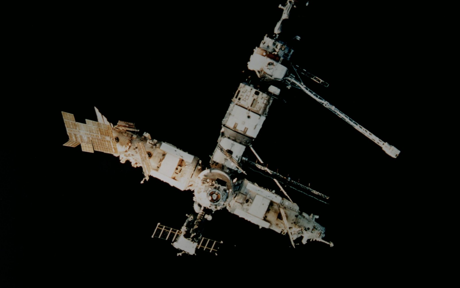 A close up of a space station with a satellite in the background (space station, international space station, space, spacecraft, satellite)