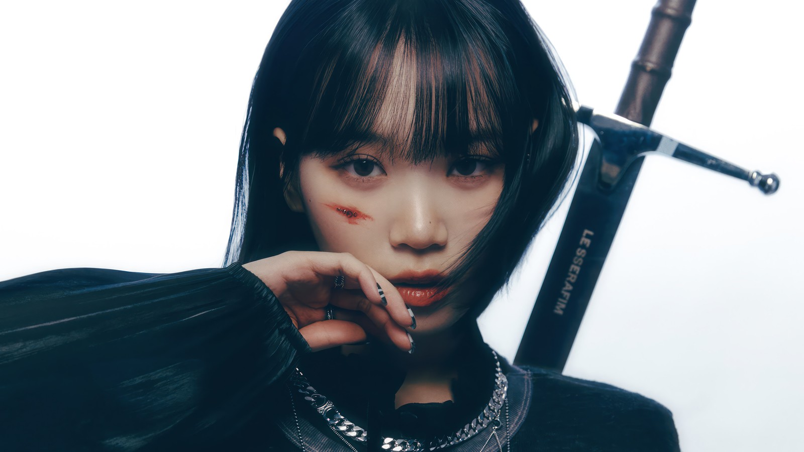 A close up of a woman with a sword and a necklace (chaewon, 김채원, kim chae won, le sserafim, 르세라핌)