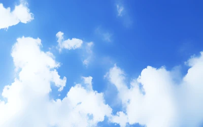 Tranquil Blue Sky with Fluffy Cumulus Clouds