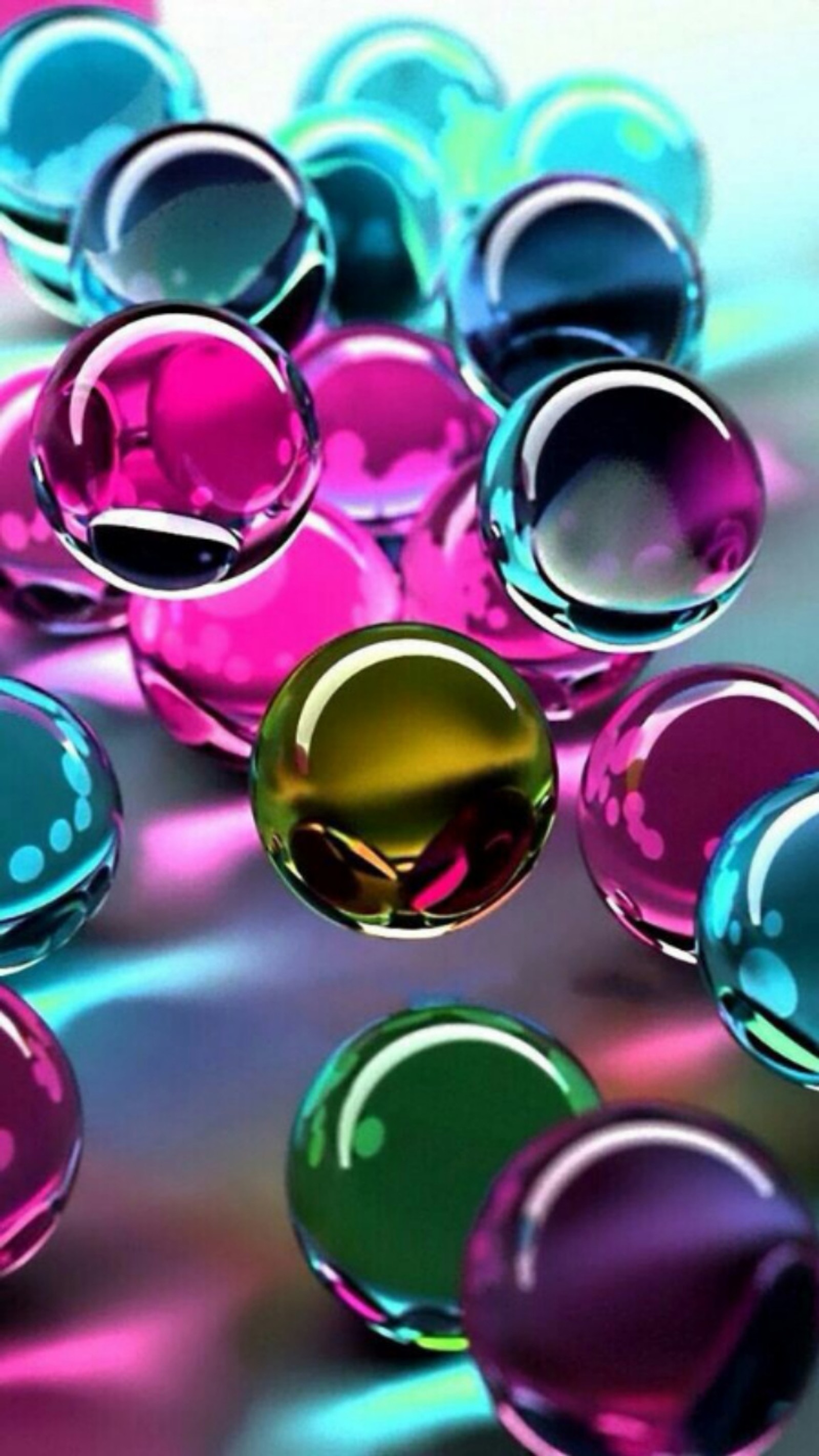 A close up of a bunch of colorful glass balls on a table (colored, spheres)