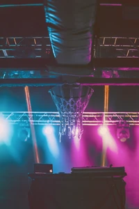 Electric Energy: A Basketball Hoop Illuminated by Vibrant Purple Lights