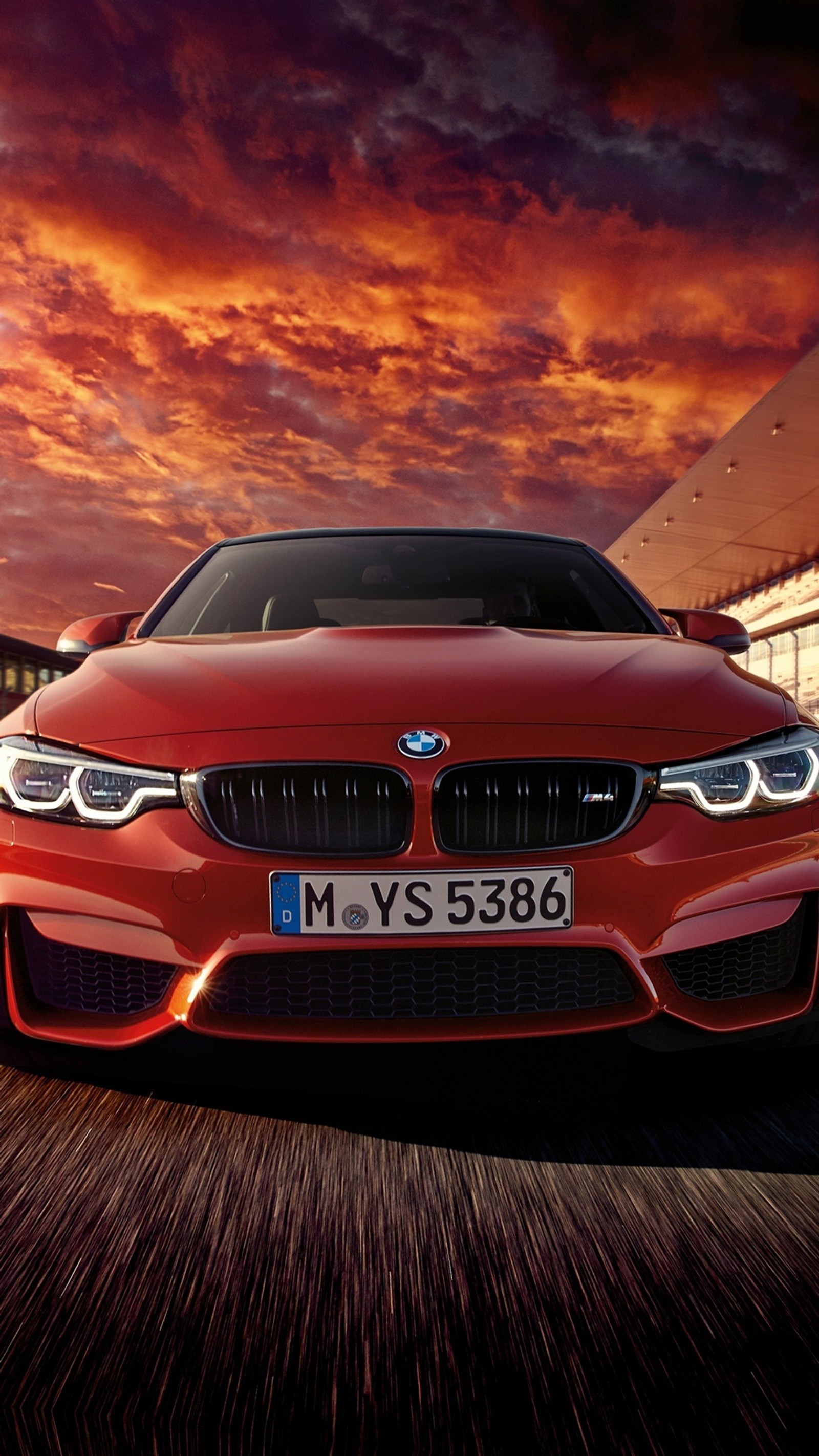 A close up of a red bmw car driving on a road (auto, bmw, car, red, super car)