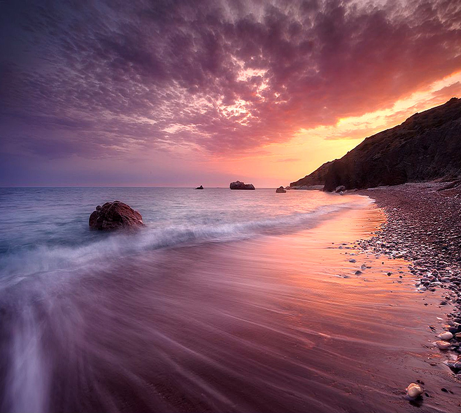 Sunset on the beach with waves crashing on the shore (beautiful, nature)