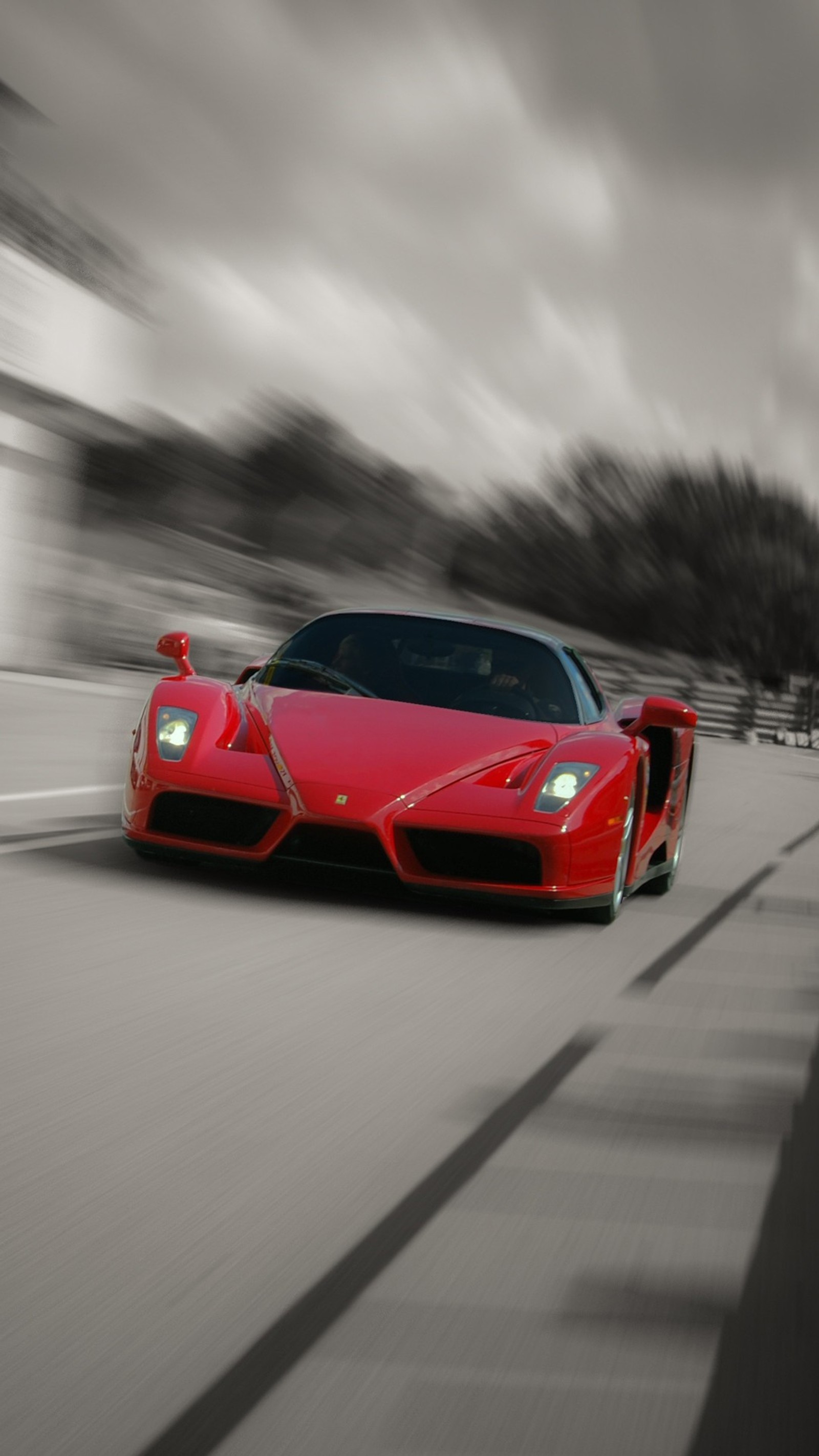 Arafed red sports car driving on a road with blurry trees in the background (1080p, enzo, ferrari, limited edition, red)