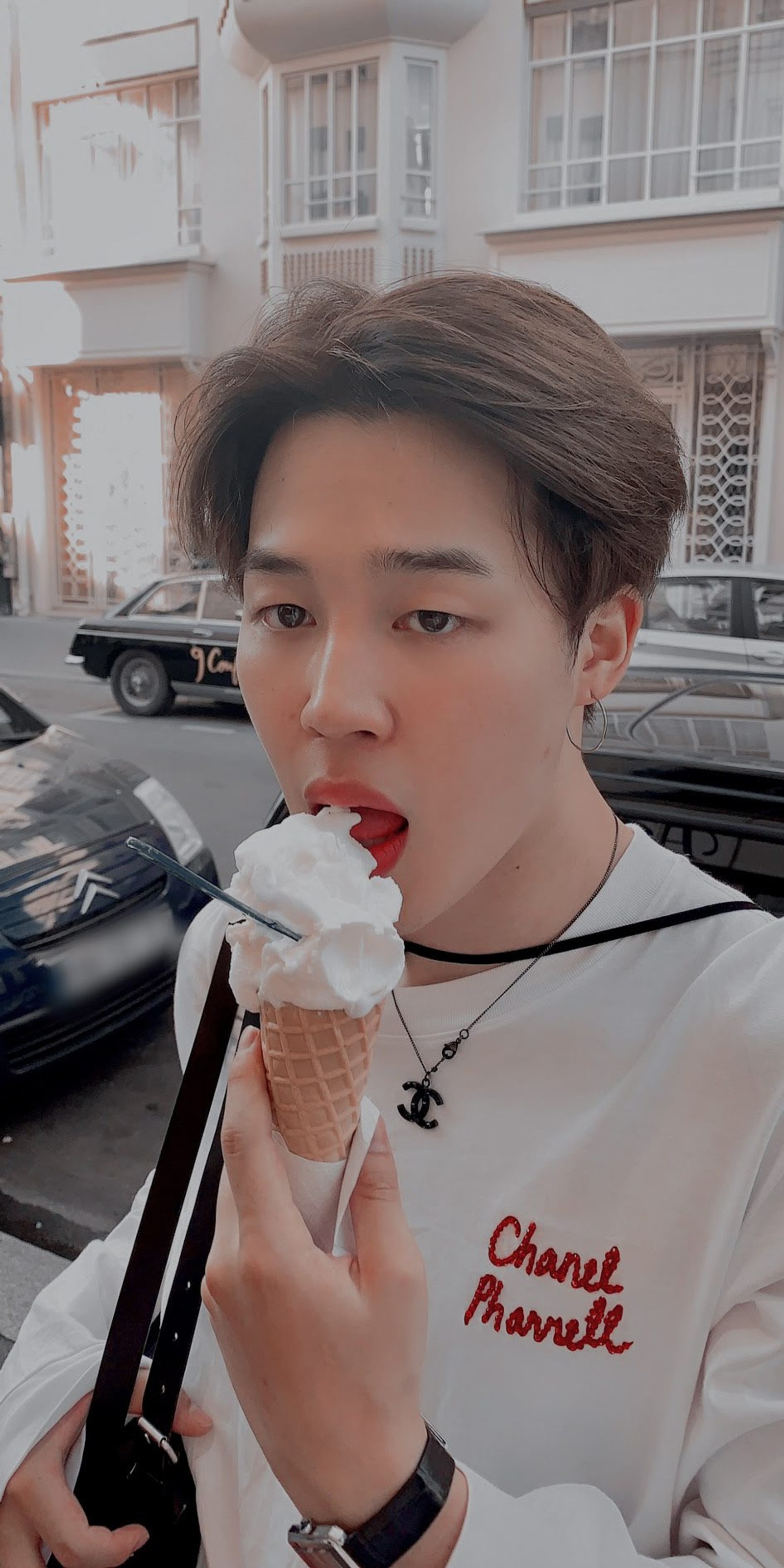 Araffe with a red lip and a white shirt eating an ice cream cone (bts, jimin bts)