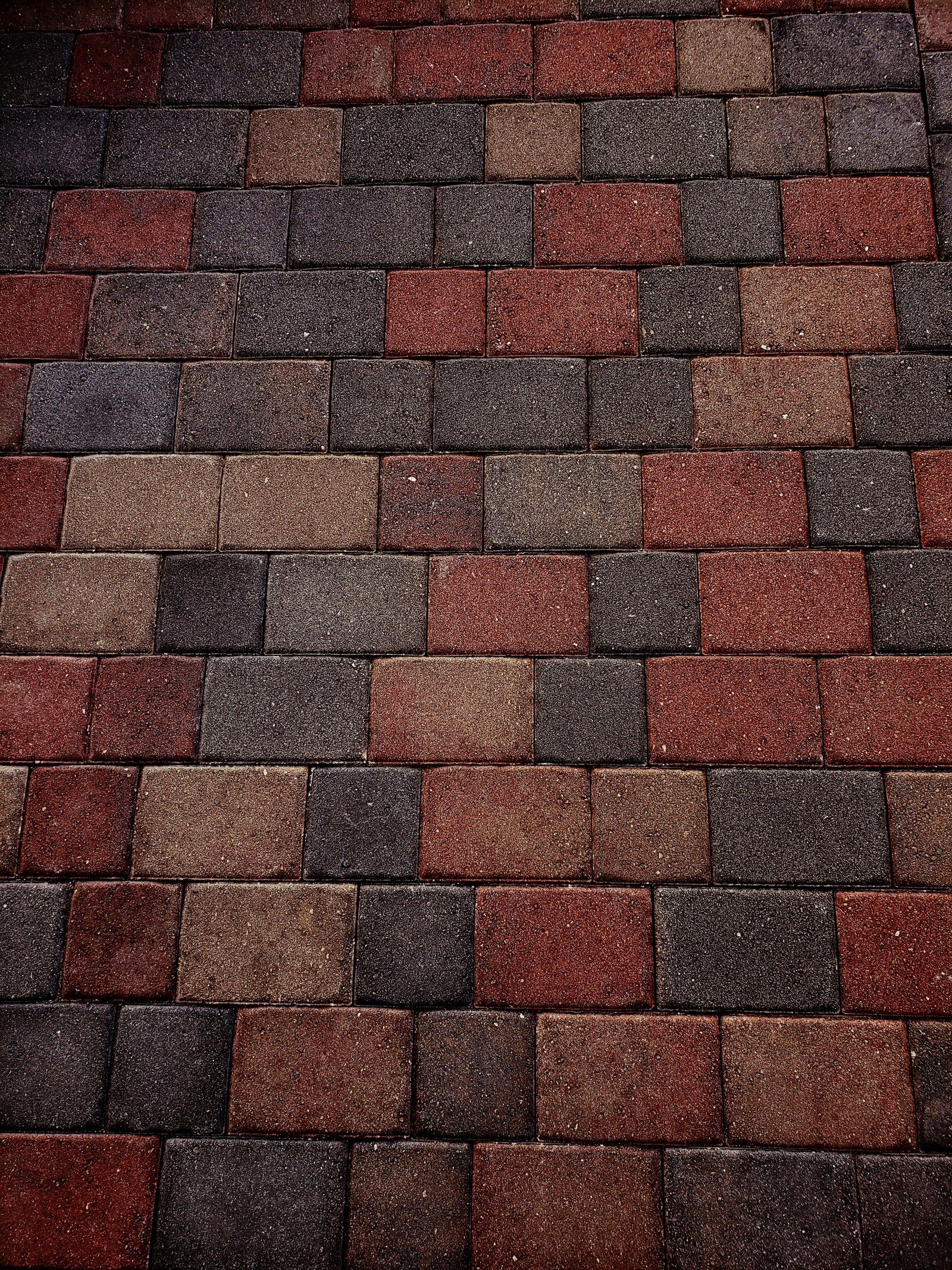 There is a red and black fire hydrant on a brick sidewalk (best, black, brick, bricks, cool)