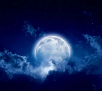 Serene Night: A Radiant Moon Illuminating Blue Clouds