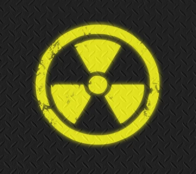 Worn Yellow Radioactive Sign on Black Background