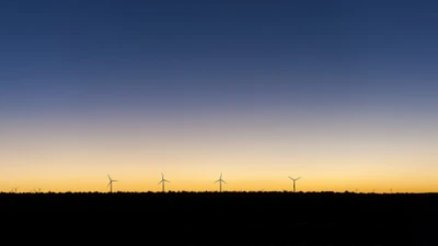 Minimalist Sunrise Over Windmills