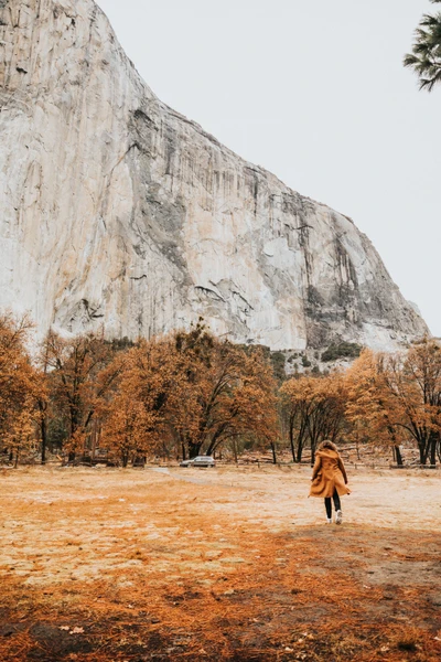 Exploring Autumn Wilderness Amidst Majestic Cliffs