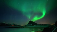 Enchanting Aurora Over Majestic Mountain Landscape