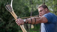 Alan Ritchson in a dynamic archery scene from "The Ministry of Ungentlemanly Warfare.