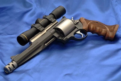 Smith & Wesson Revolver with Scope on Blue Fabric Background