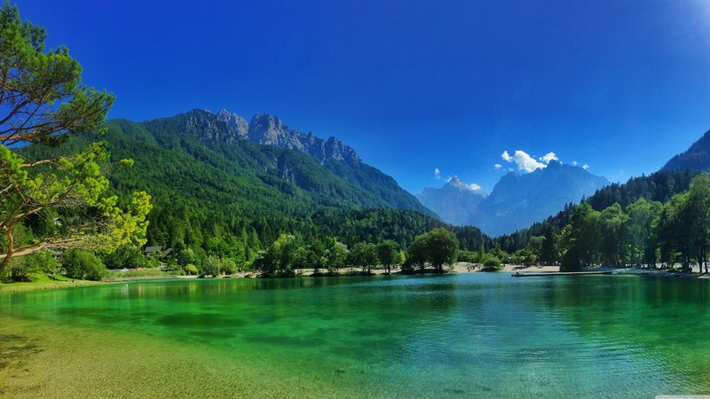 A view of a lake with a mountain in the background (blue, hd, shine, water)