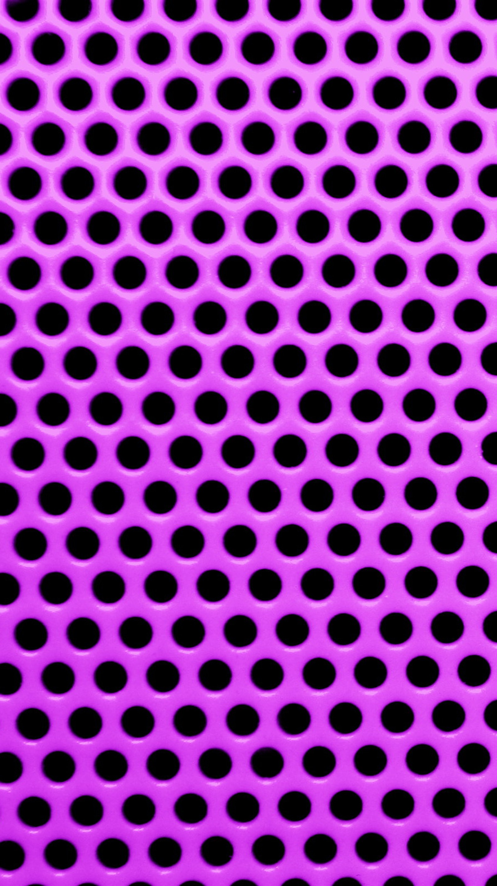 A close up of a purple background with black dots (abstract, metal, purple, round holes, texture)