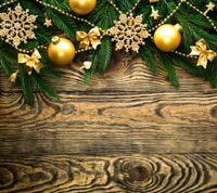 Merry Christmas Decorations with Golden Ornaments and Fir Branches on Wood Background