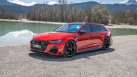 2023 Audi RS6 Edición Legado: Impactante Wagon Rojo de Rendimiento en el Pintoresco Lago