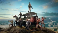 Equipe de jogadores estrategizando no PUBG em um afloramento rochoso