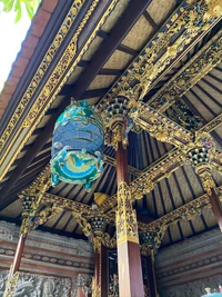 Intricate Carvings and Vibrant Lanterns in a Balinese Temple Ceilings