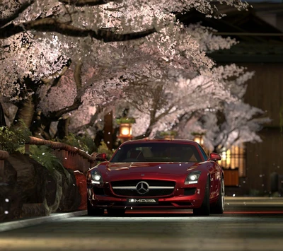 Mercedes SLS entre flores de cerejeira à noite.