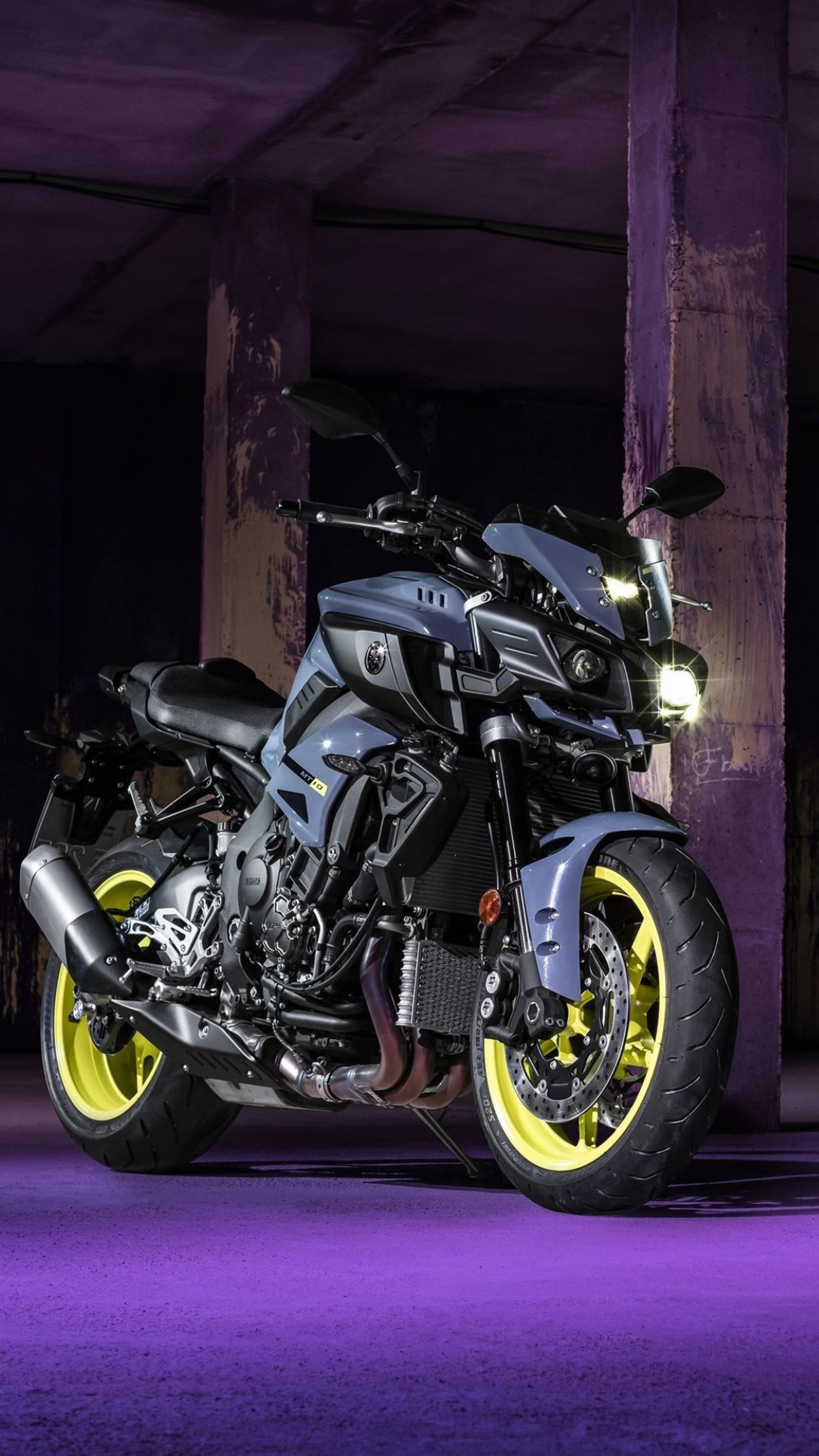 Arafed motorcycle parked in a parking garage with a purple background (bike, fast, motor, motorcycle, race)