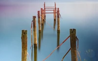 Serene Reflection at a Broken Pier