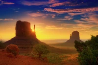 Lever de soleil à couper le souffle sur Monument Valley : un paysage majestueux de l'écosystème du Grand Canyon