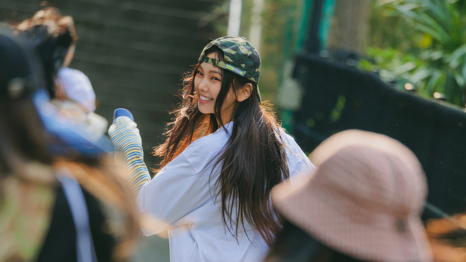 Araffe woman in a white shirt and a hat is holding a baseball bat (hyein, 혜인, lee hye in, 이혜인, newjeans)