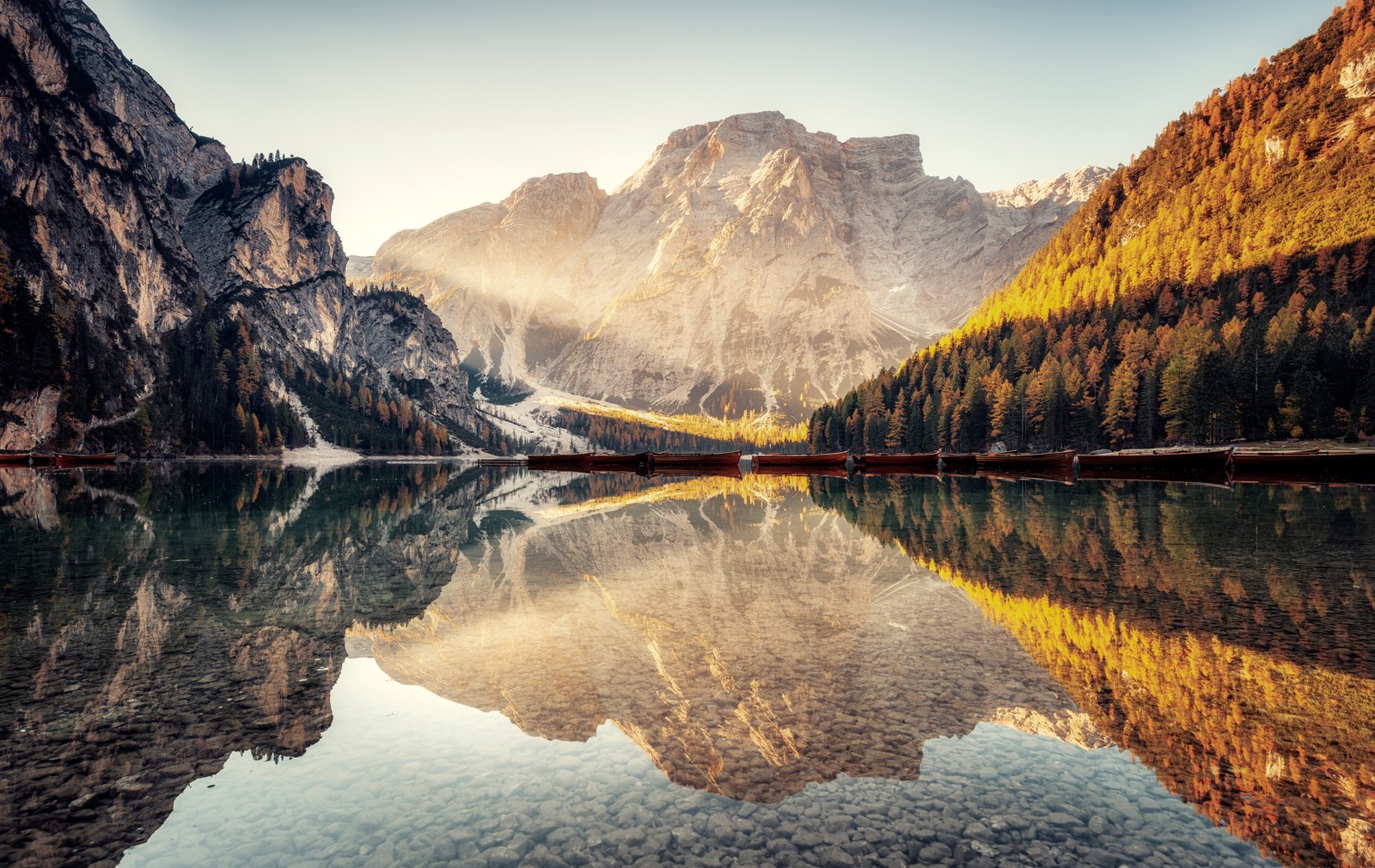 A view of a lake with mountains in the background (pragser wildsee, scenic, lake, dolomite mountains, italy)