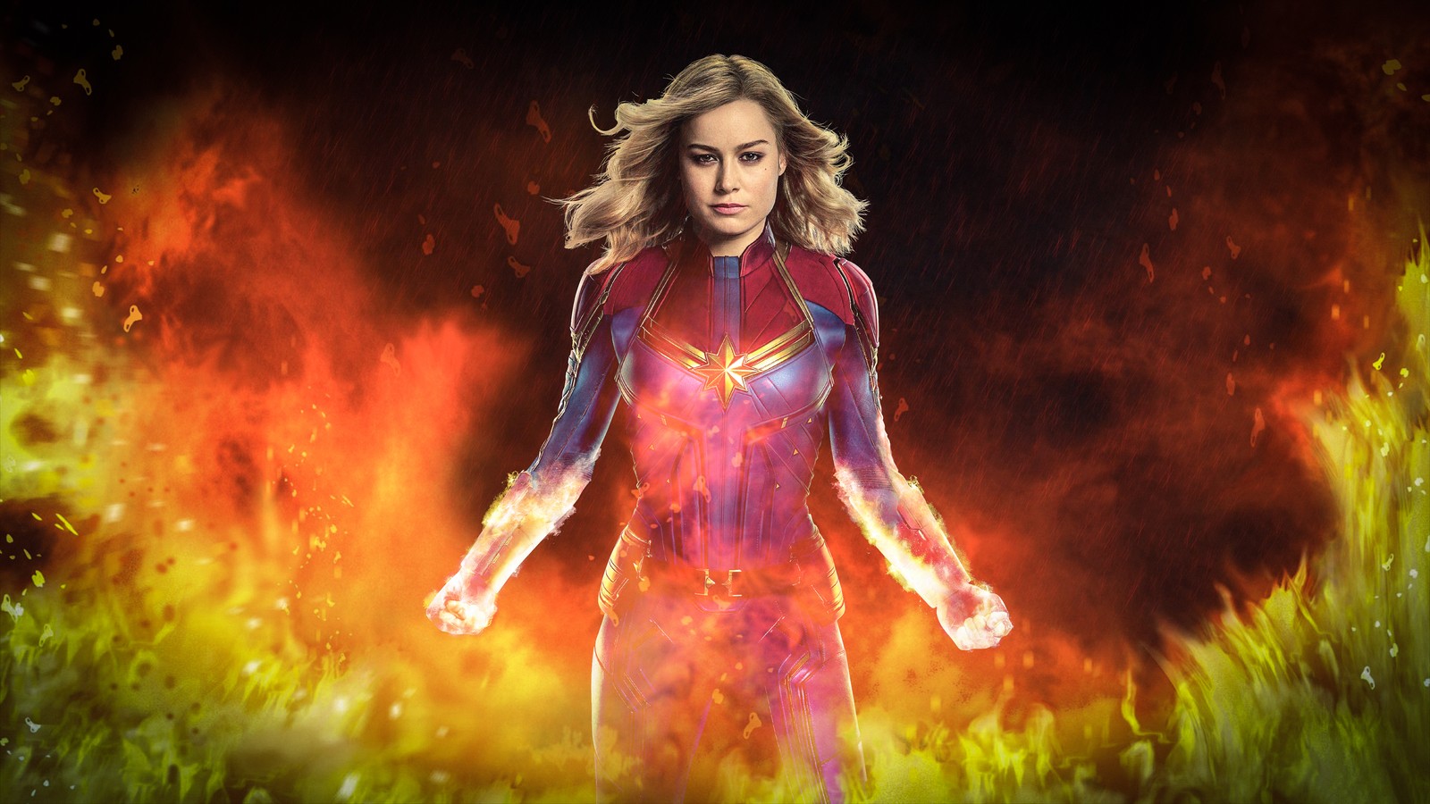 A woman in a red and yellow costume standing in a field of grass (captain marvel, carol danvers, flame, illustration, fractal art)