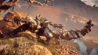 A mechanical dragon-like creature lies on rocky terrain, showcasing intricate metallic details, surrounded by a vast open landscape, evoking the adventurous spirit of an open-world role-playing video game.