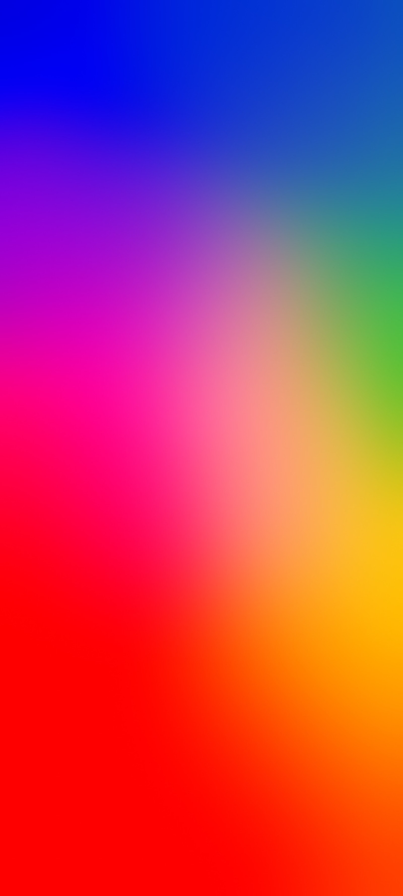 A close up of a colorful blurry background with a red, yellow, blue, and green (orange, colorfulness, purple, violet, magenta)