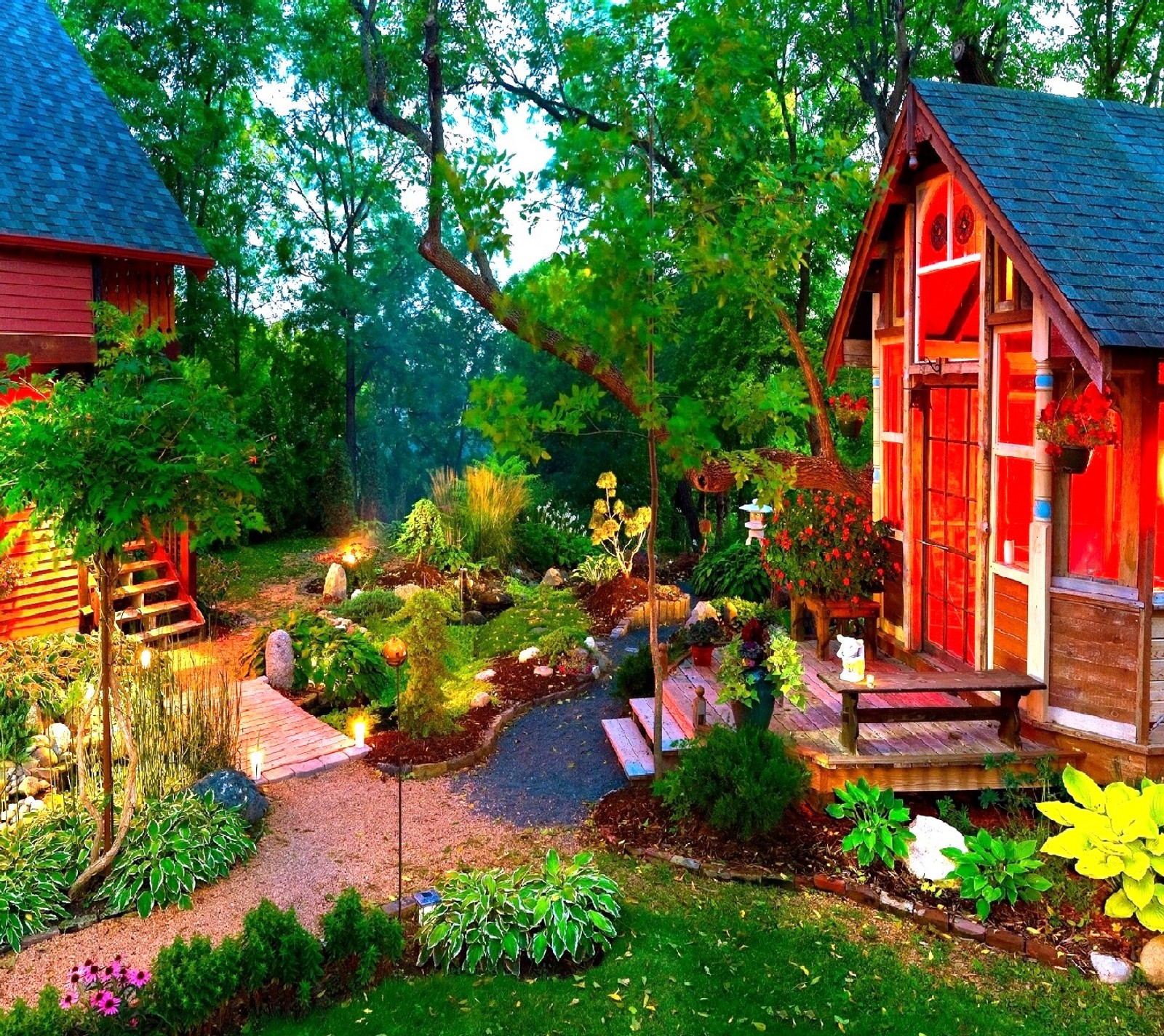 A close up of a small house with a garden and a pathway (nature)