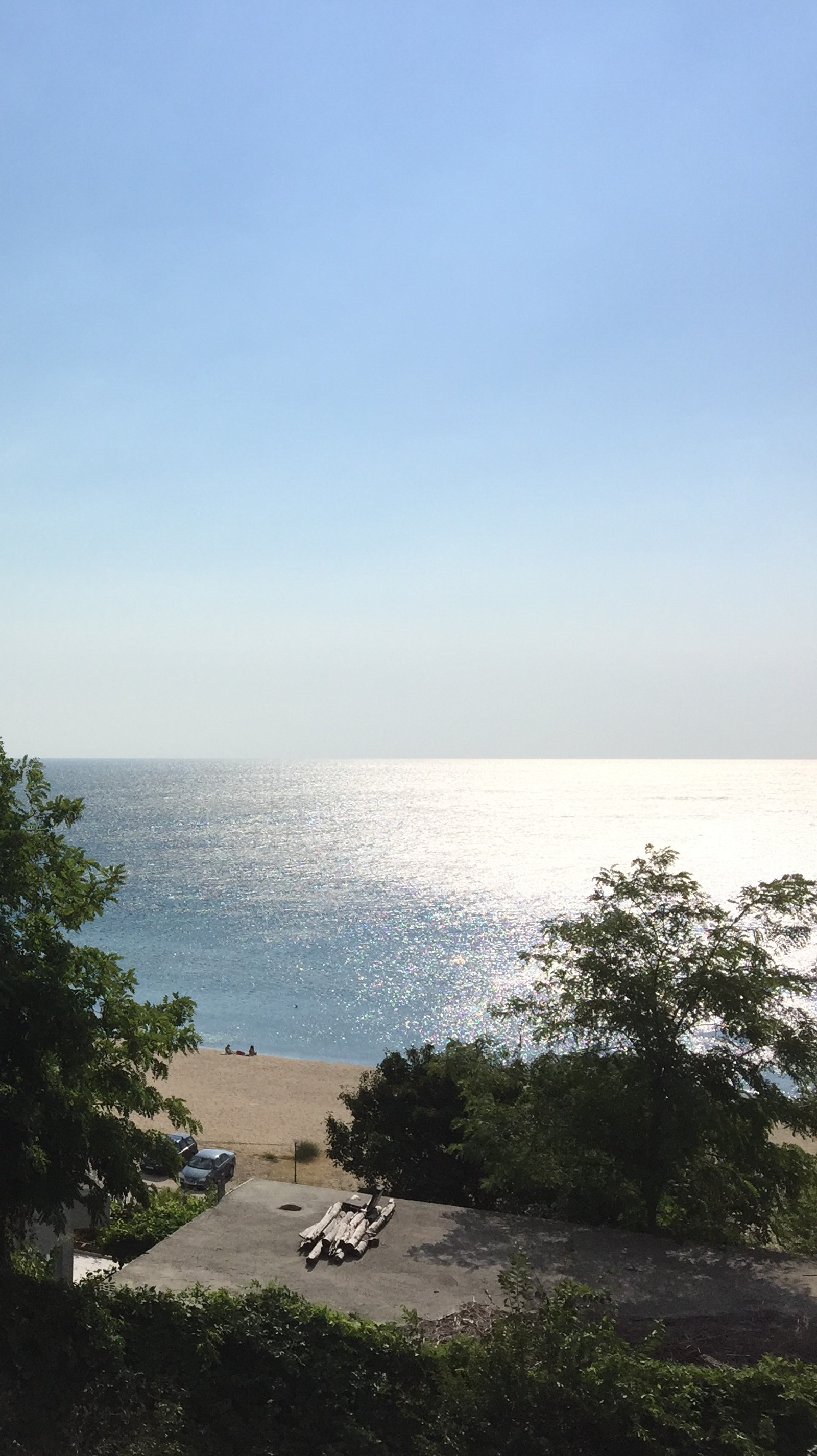 There is a view of the ocean from a balcony of a house (sea, sea view)