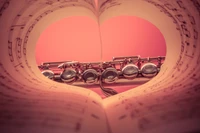 Flute Surrounded by Heart-Shaped Sheet Music