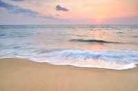 Serene Sunset Over Gentle Waves on the Shoreline