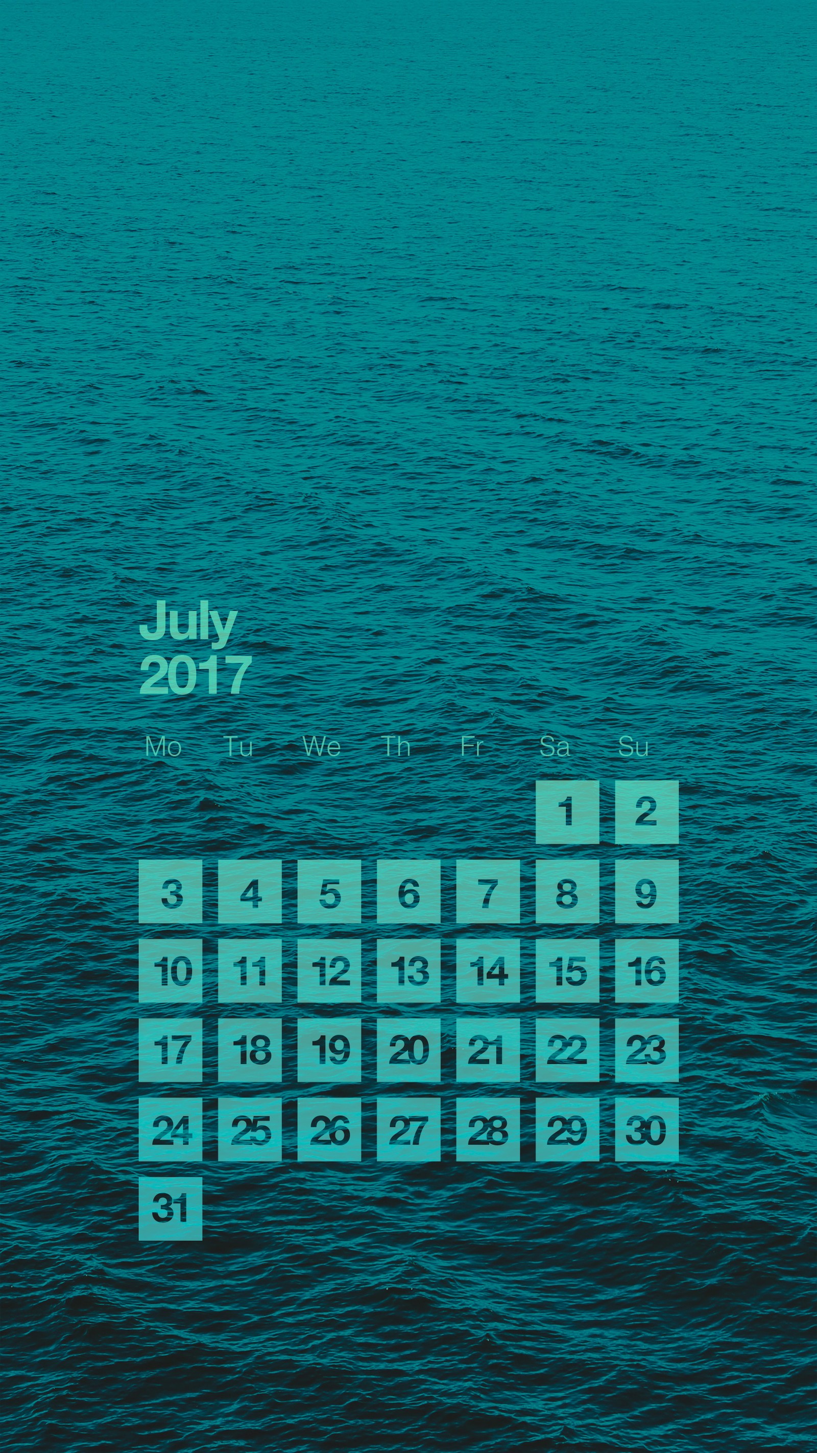 A close up of a calendar on a wall with a blue background (2017, blue, calendar, clean, green)