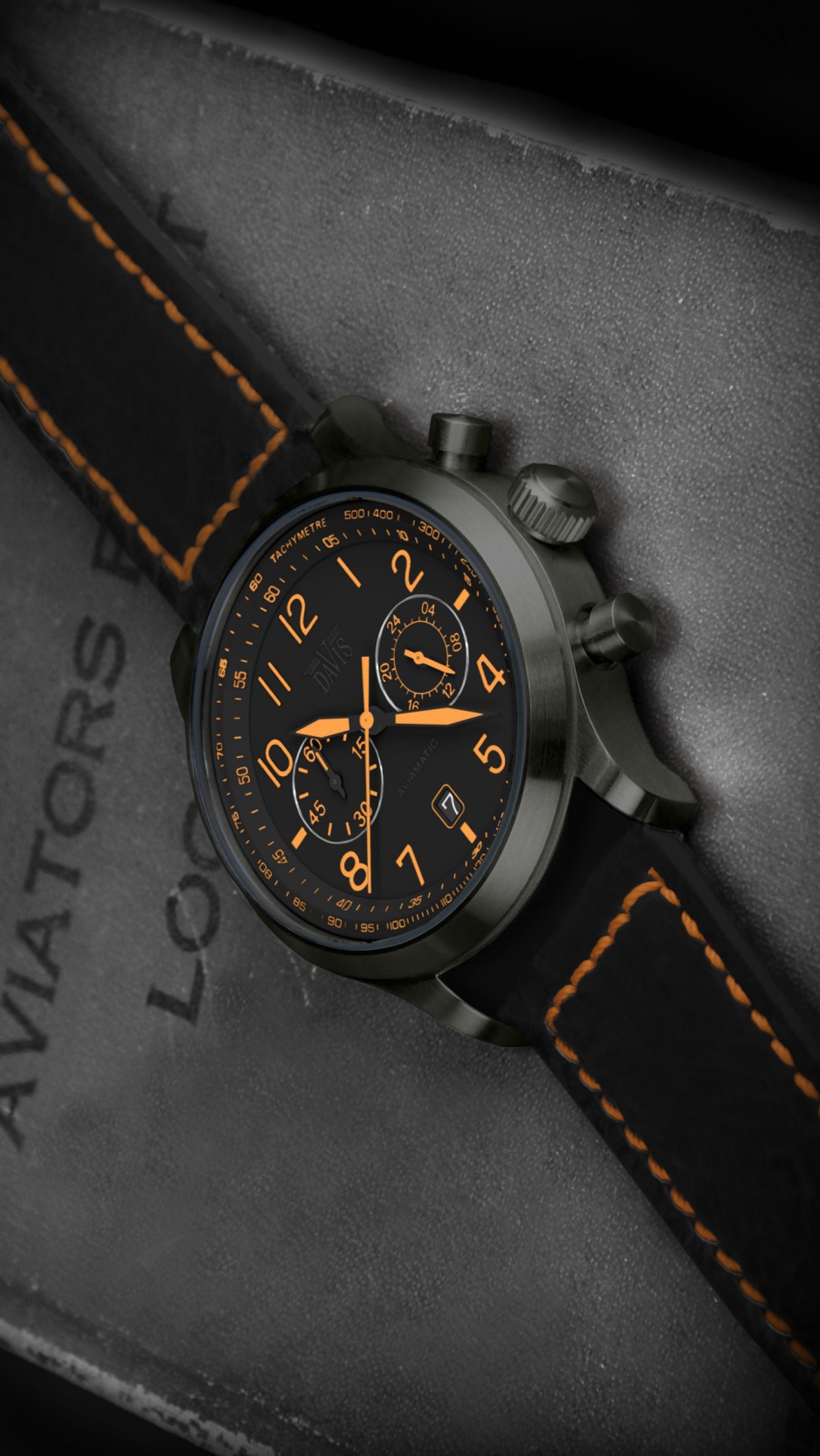 A close up of a watch with a black face and orange hands (clock, design, watch)