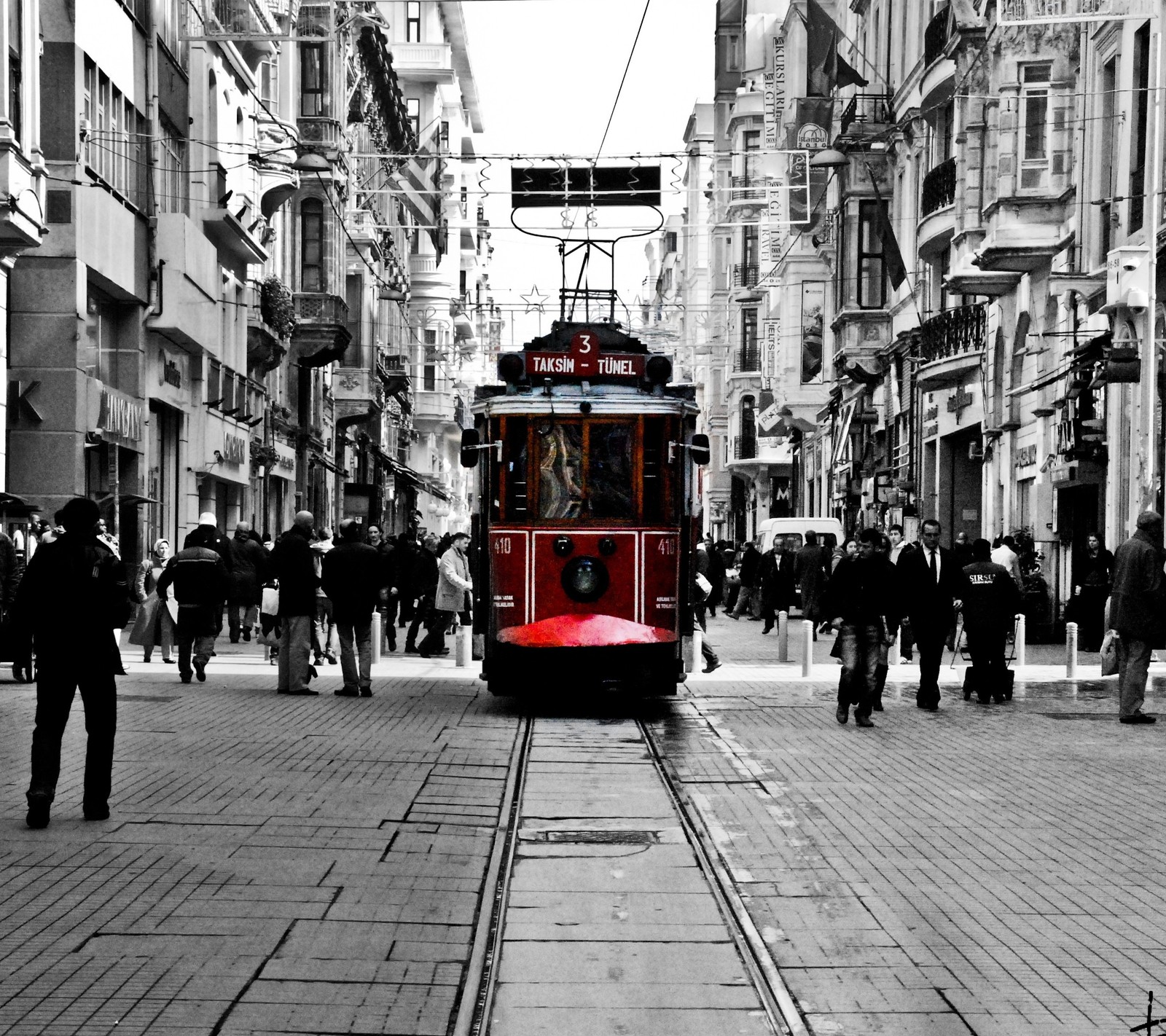 Araful trolley on a city street with people walking around (black, hd, istanbul, red, tram)