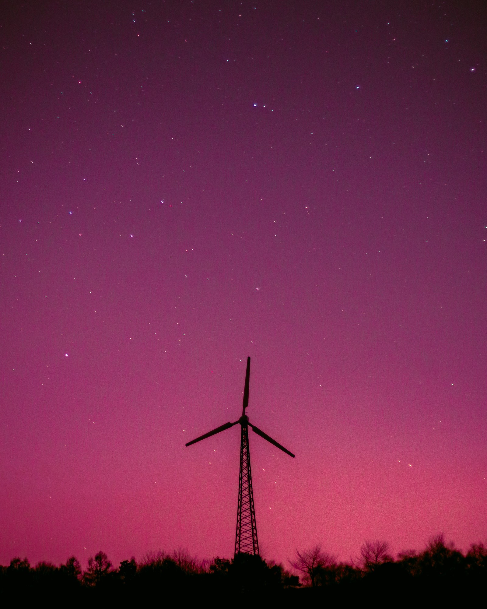 Arafed windmill in the foreground of a pink sky with stars (purple, atmosphere, pink, night, magenta)