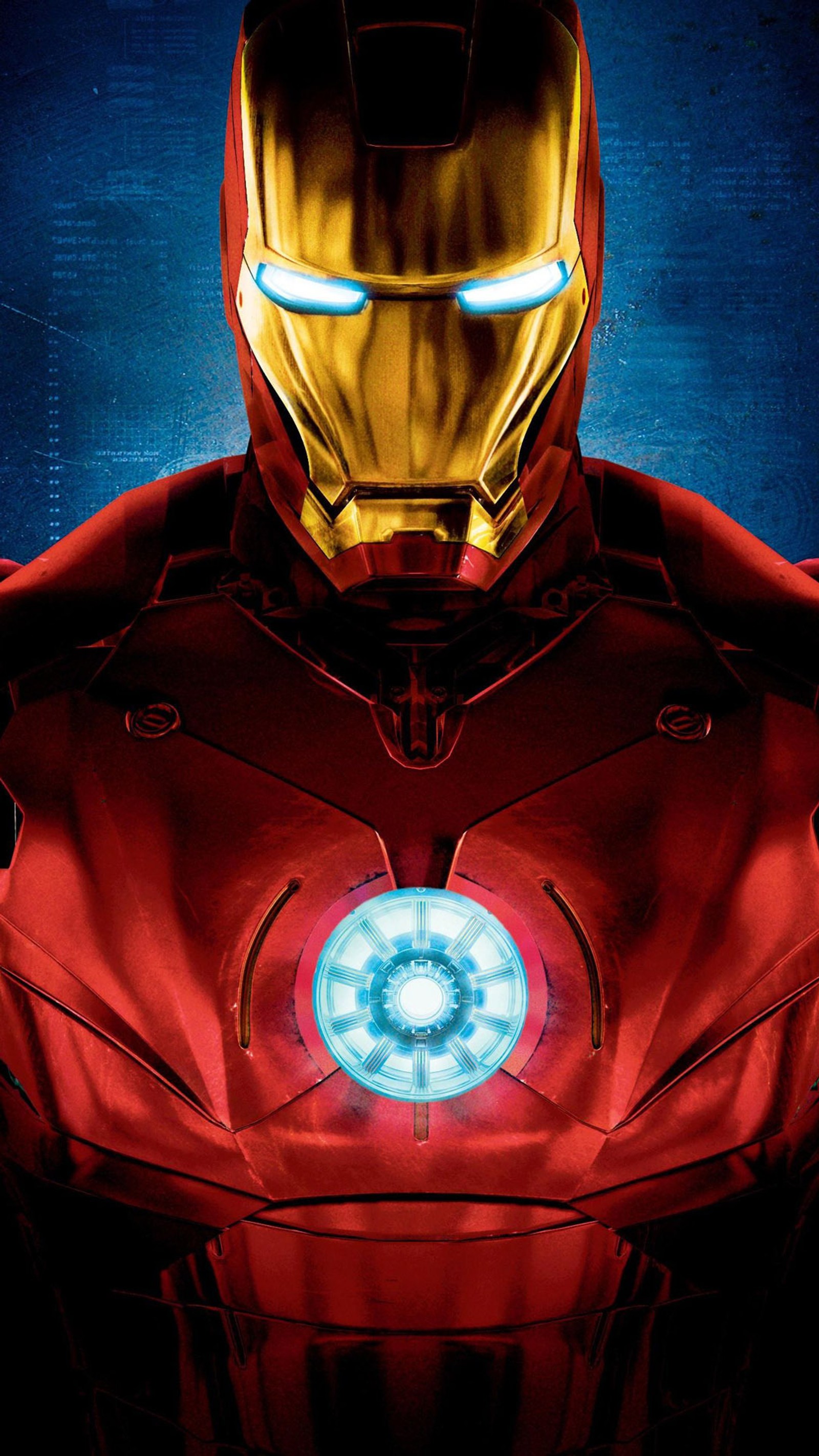 Iron man with glowing eyes and armor standing in front of a blue background (avengers, iron man, jarvis, marvel, movies)