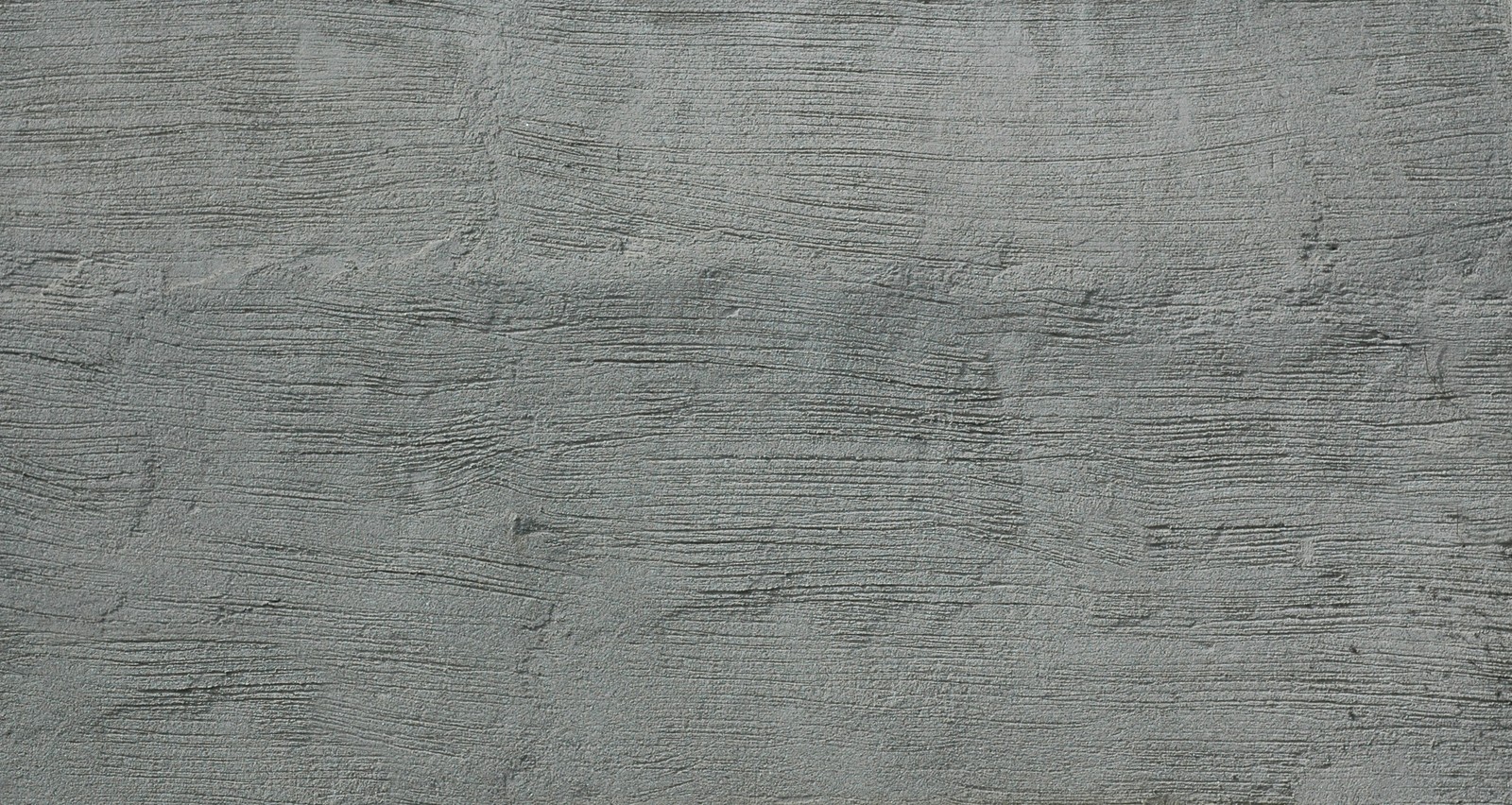 Arafed concrete wall with a rough surface and a small white object (concrete, road surface, wood, cement, texture)